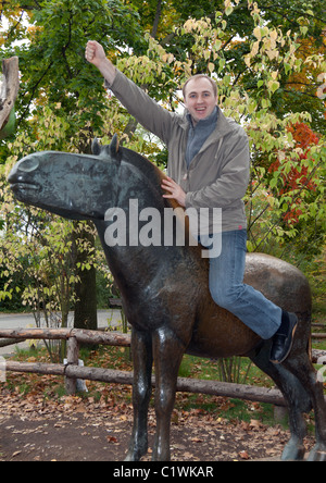 Man on a brass horse monument in the autumn in Prague Stock Photo