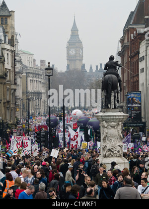 Protesters march down Whitehall as they take part in a demonstration against Government cuts in London.