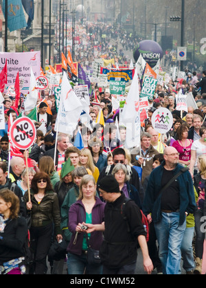 Protesters march down Piccadilly during an anti Government demonstration against public spending cuts Stock Photo