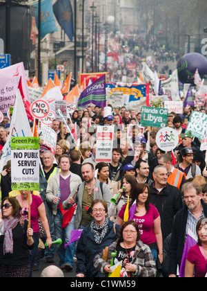 Protesters march down Piccadilly during an anti Government demonstration against public spending cuts Stock Photo