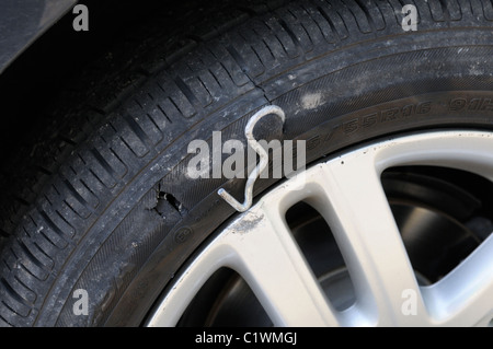 Flat, punctured tire Stock Photo