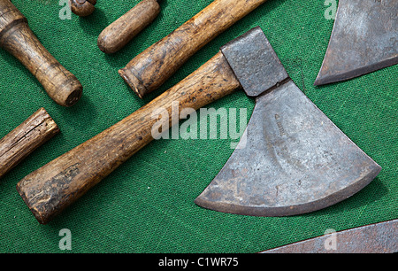 Used tools on sale in Sunday market with an axe in the centre Foix Ariege France Stock Photo