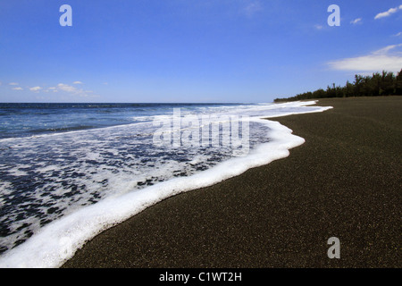 black volcanic sand beach - Etang Salé Stock Photo