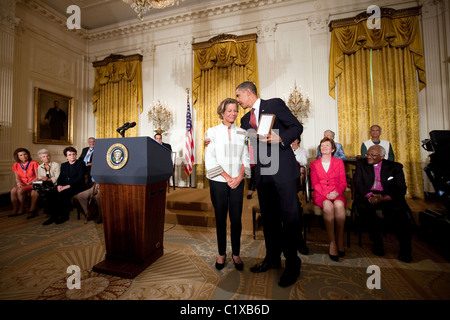 President Barack Obama presents the 2009 Medal of Freedom to Kara Kennedy, accepting the award on behalf of her father, Sen. Stock Photo