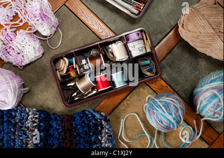 Knitting and sewing supplies on a table Stock Photo