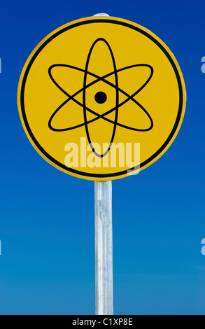 A nuclear sign isolated on a blue graduated sky. Stock Photo