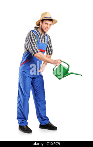 Full length portrait of a male gardener with watering can Stock Photo