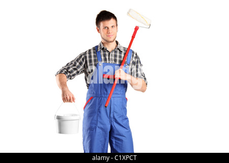 Smiling worker man holding a paint roller and bucket Stock Photo