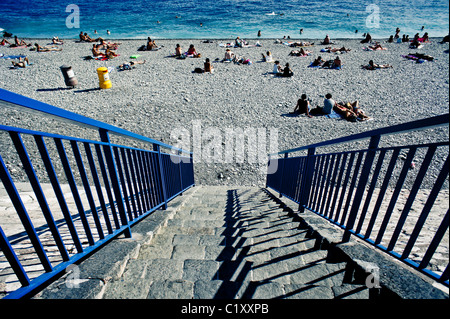 Steps leading down to a shingle beach Stock Photo