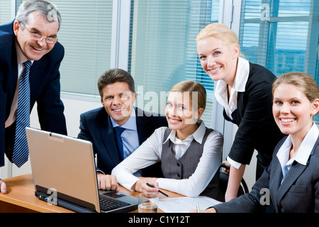 Portrait of confident co-workers looking at camera with smiles Stock Photo