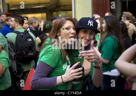 Large numbers of teens 'letting off steam' at the Saint Patrick's Day Parade in New York City. Stock Photo