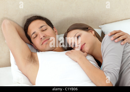Serene woman lying on her boyrfriend Stock Photo