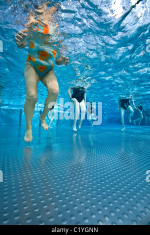 In the Vichy swimming pool, a water aerobics session for senior citizens (France). Stock Photo