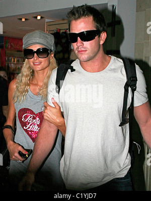 Paris Hilton, wearing a t-shirt with her name on it, arriving at LAX with her boyfriend Doug Reinhardt to catch a flight to Stock Photo