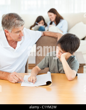 Father helping his son with his homework Stock Photo