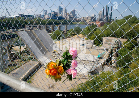 Flowers placed on fence overlooking I-35W Bridge collapse 2007. Minneapolis Minnesota MN USA Stock Photo