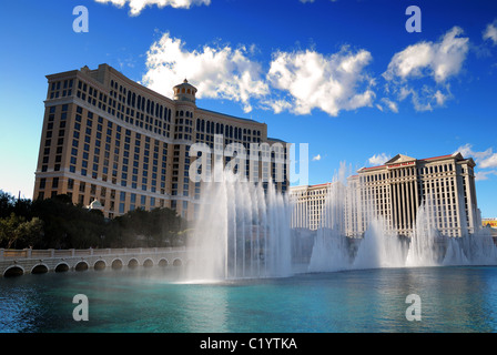 Bellagio fountain show with Caesars Hotel Casino, Las Vegas, on strip. Stock Photo