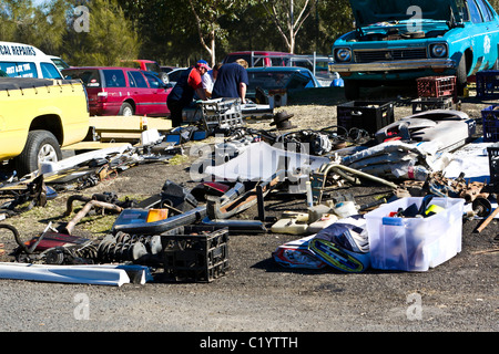 Car parts and other junk for sale at a market. Stock Photo