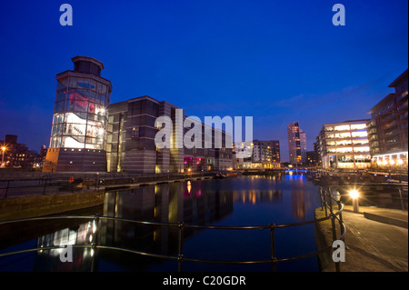 royal armouries building reflected in dock on the aire/calder canal at dusk leeds yorkshire uk Stock Photo