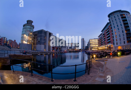 royal armouries building reflected in dock on the aire/calder canal at dusk leeds yorkshire uk Stock Photo