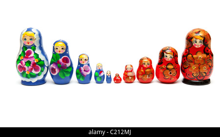 Russian nesting dolls stand in a row on a white background Stock Photo