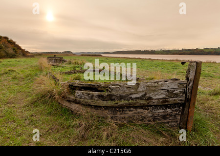 One of the wooden barges beached on the banks of the River Severn at the Purton Hulks Ships Graveyard, Purton, Gloucestershire Stock Photo