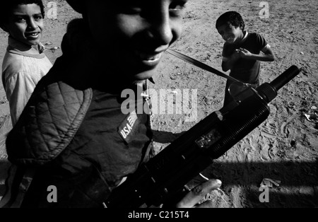 Jabalya Refugee Camp, Gaza 1988. Children with toy guns during the Intifada against the Israeli occupation. Stock Photo
