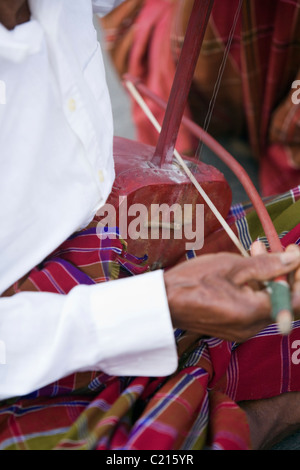 Thai musician playing a saw u (bowed string instrument) at the Surin ...