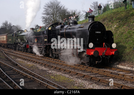 Steam engines double heading a train on the Mid-Hants Railway - GWR Pitchford Hall behind U-class. Stock Photo