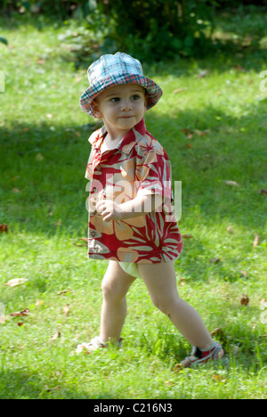 A boy walking on the meadow Stock Photo