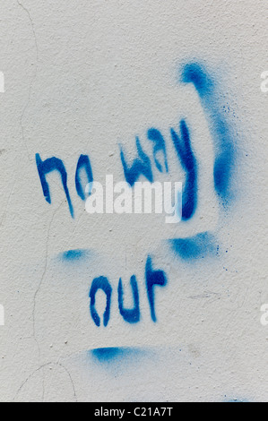 Stencil / Graffiti showing the wording 'no way out' in blue color on a white wall in Munich, Germany Stock Photo
