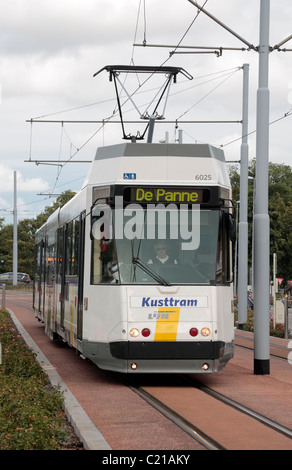 An electric tram going to 'De Panne' passing through Nieuwpoort, West Flanders, Belgium. Stock Photo