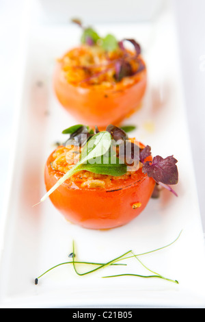 Starter of rice stuffed tomatoes. Stock Photo