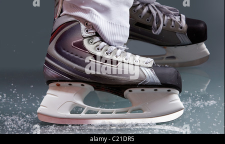 Close-up of skates on player feet during ice hockey Stock Photo