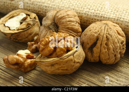 Walnuts on old wooden board Stock Photo