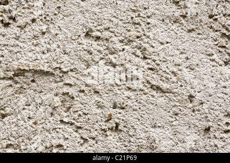 texture on the concrete and pebble render on the wall of a building. Stock Photo