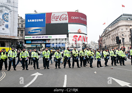 tuc march for change london 26th march 2011 with line of riot police at Piccadilly circus london Stock Photo