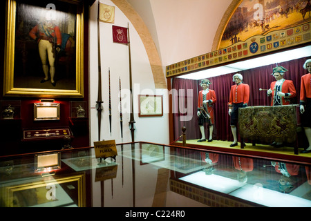 Painting & costumes & other exhibit s on the wall in the museum tour of Sevilla bullring / bull ring building. Seville, Spain. Stock Photo