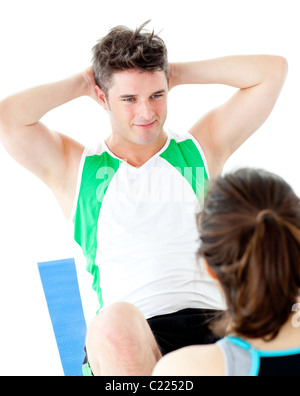 Handsome man doing fitness exercises with a woman Stock Photo