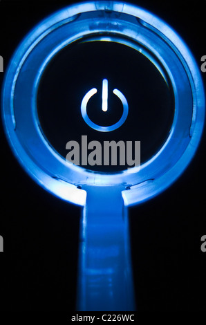 Power/standby switch lit up blue Stock Photo - Alamy