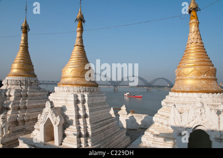 Stupas with irrawaddyi river and yadanabon bridge in the background. Sagaing. Myanmar Stock Photo