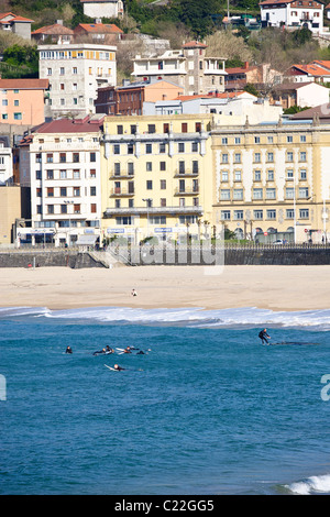 Surfers off Zurriola beach, San Sebastián, Spain. Stock Photo
