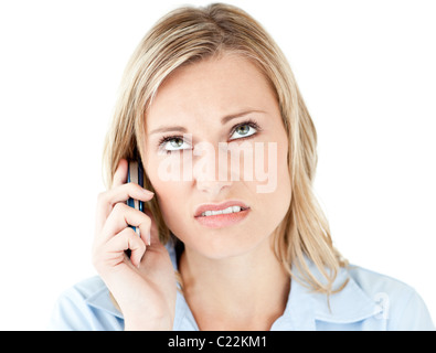 Frustrated businesswoman talking on phone Stock Photo
