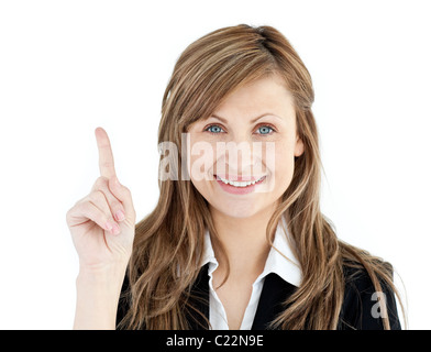 Cheerful businesswoman pointing upward isolated against white background Stock Photo