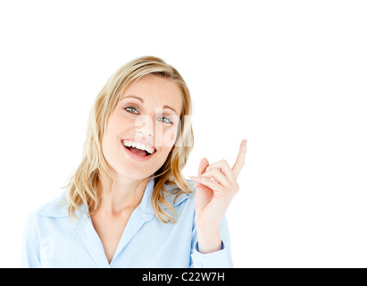 Cheerful businesswoman pointing upward isolated Stock Photo