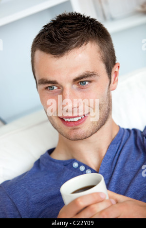 Attractive man drinking a coffee Stock Photo
