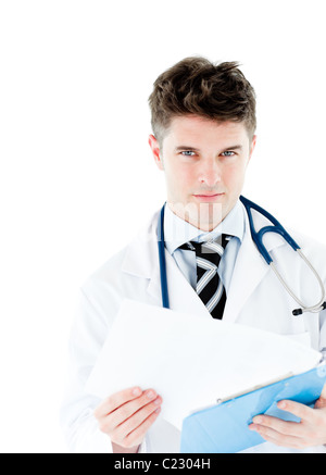 Smiling doctor holding pen Stock Photo