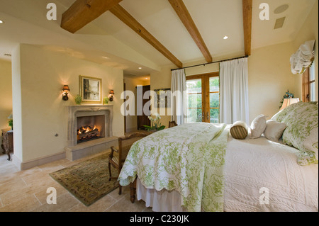 Bedroom interior with fireplace Stock Photo