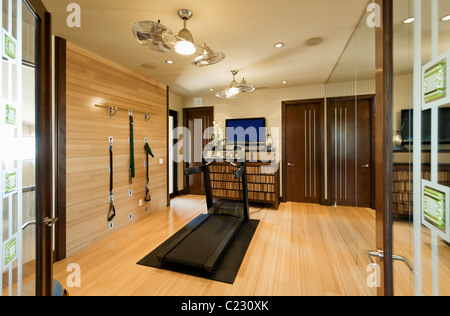 Interior with gym equipment and wooden floor Stock Photo