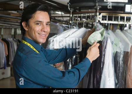 Man working in the laundrette Stock Photo